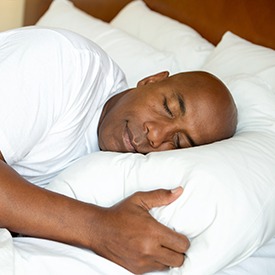 Man sleeping deeply in bed
