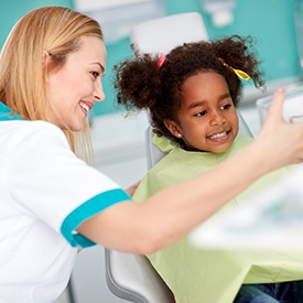 Little girl smiling in dental chair