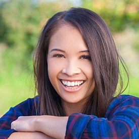 Smiling young woman outdoors