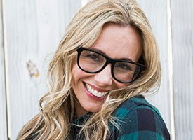 Woman wearing glasses with gorgeous smile