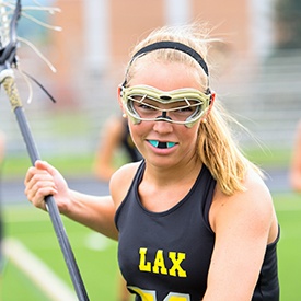 Female lacrosse player wearing sportsguard