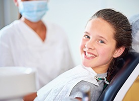 Young girl smiling in dental chair