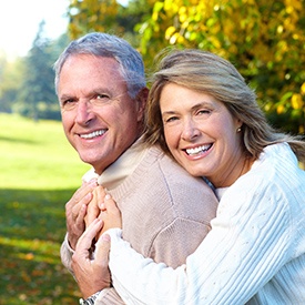 Senior couple smiling outdoors